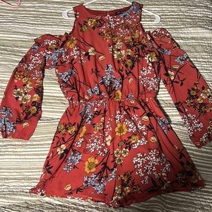 Romper, with cut out shoulders, buttons down the back. Size L